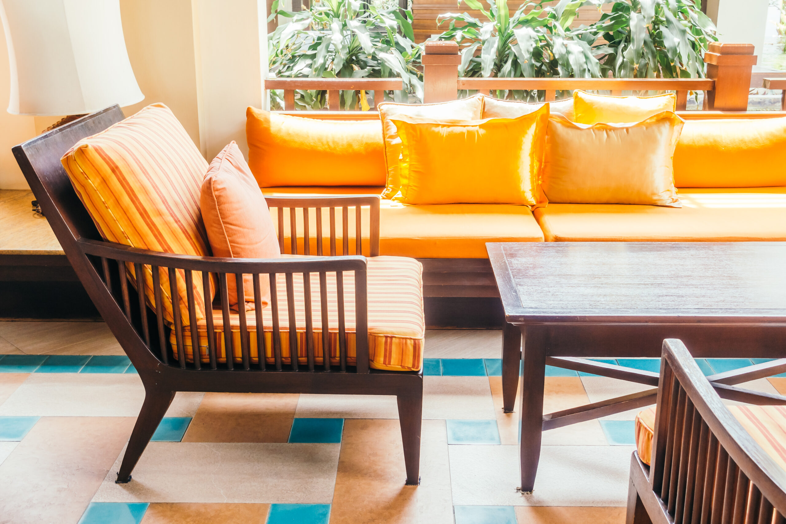 Empty wooden sofa with pillow and chair decoration in living room interior - Vintage Filter